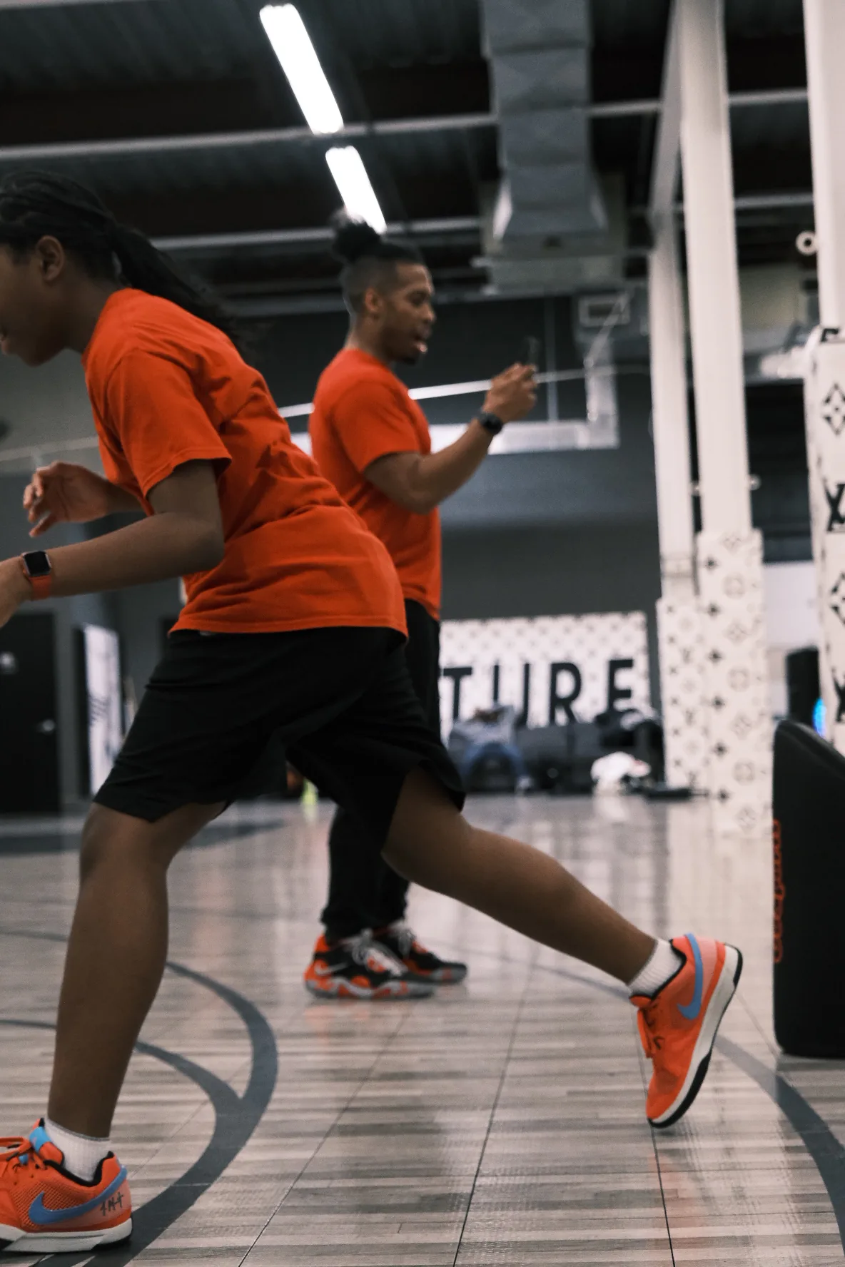 Sprint and conditioning drill with two players in motion at Benjamin Buckets Training